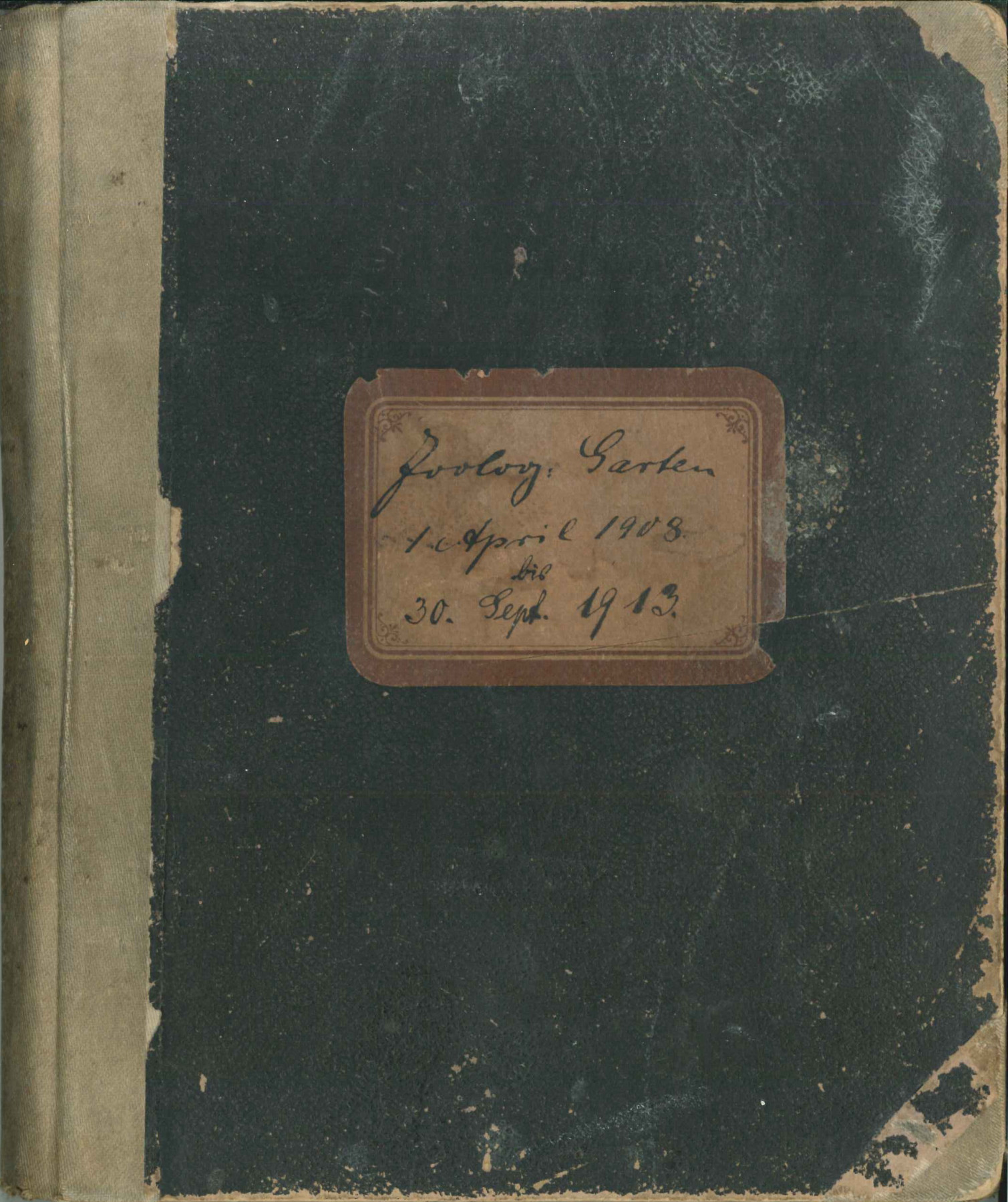 Frontispiece of a scuffed dark green notebook for accession entries, with a label in the front reading: Zoological Garden, 1 April 1908, 30 September 1912.